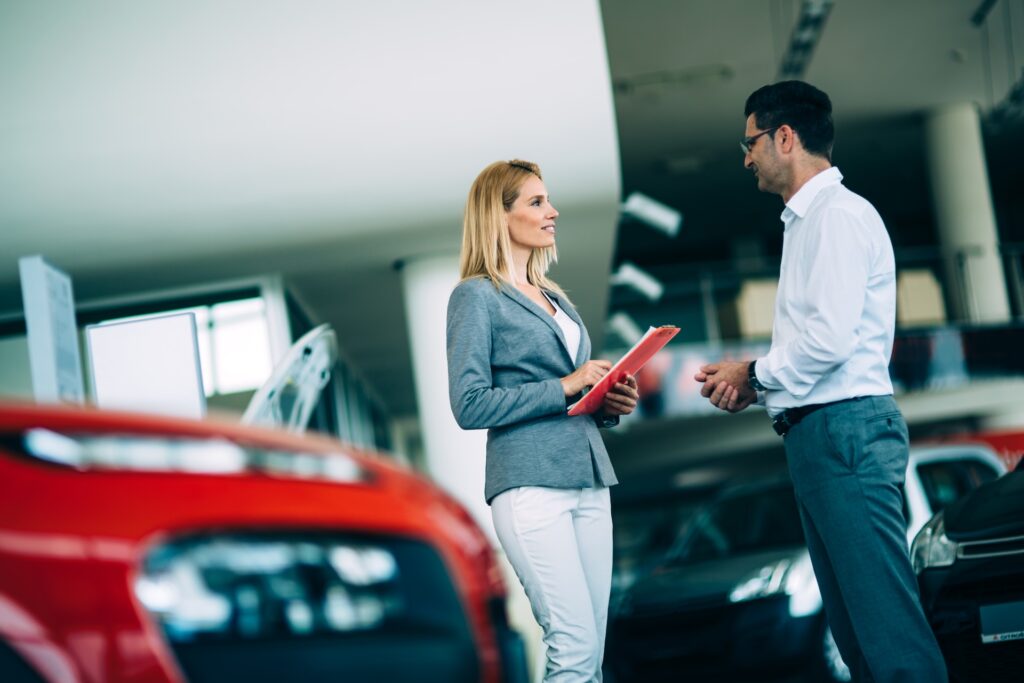 professional salesperson selling cars at dealershi 2025 03 15 00 06 00 utc